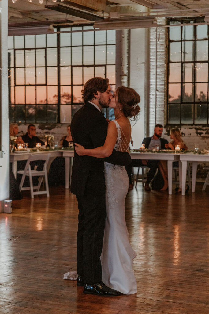First dance photos with the Cleveland sunset coming through the windows of BLDG17