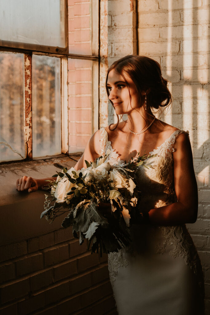 Bride soaking in golden light through the BLDG17 windows