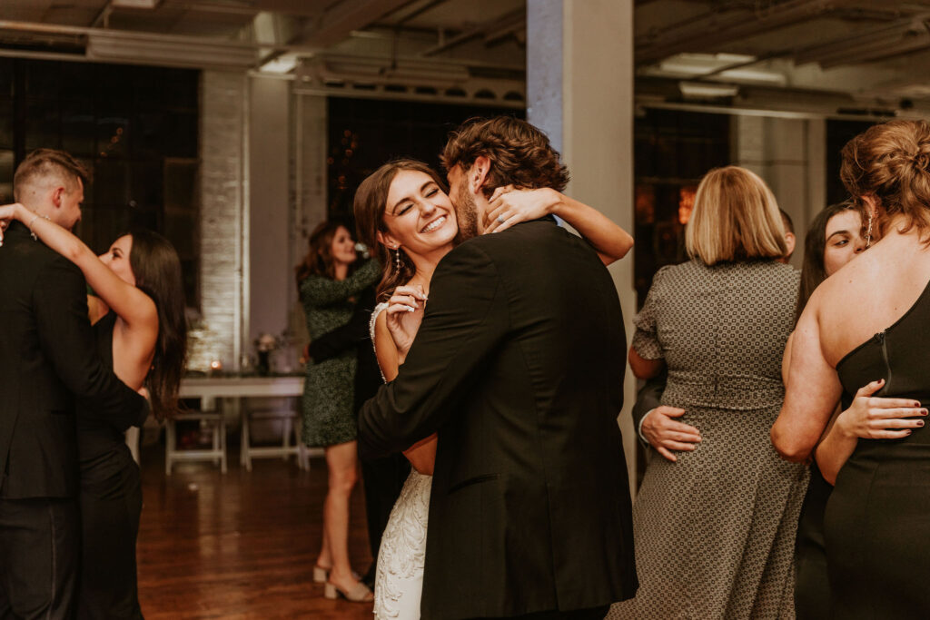 Cleveland couple cozied up on the dance floor during their modern wedding reception