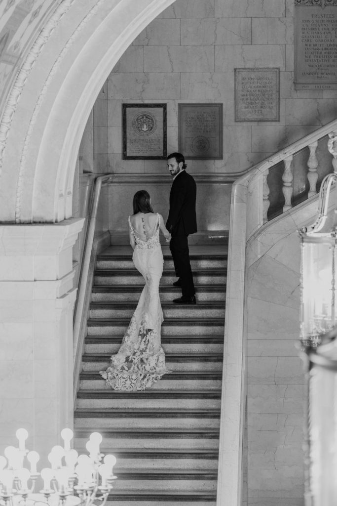 Elegant post wedding portraits on the Cleveland Public Library's grand staircase