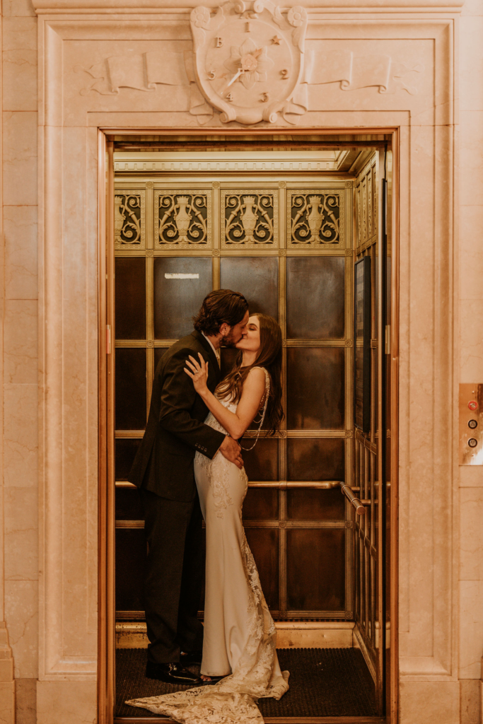 Couple kissing in the elegant and vintage elevator in the Cleveland Public Library