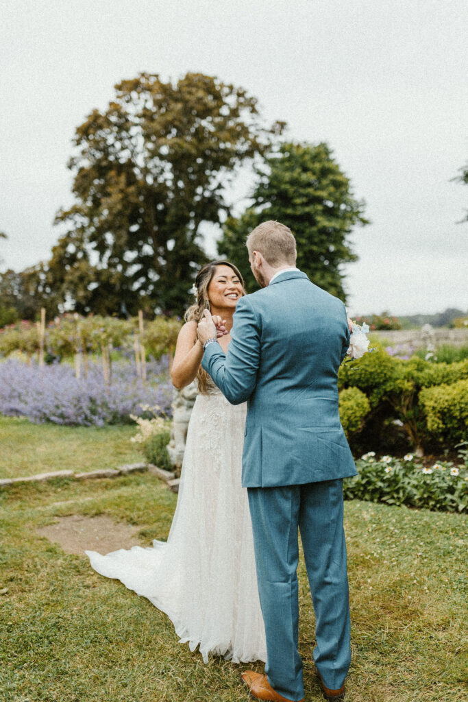Sweet first look moment in the gardens