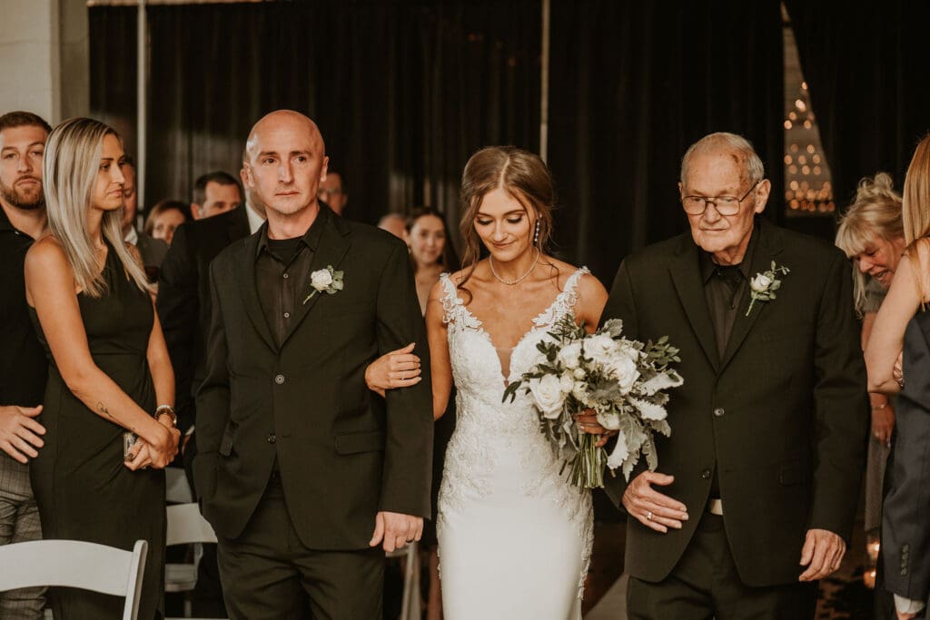Bride walking down the isle of their contemporary wedding ceremony at BLDG17