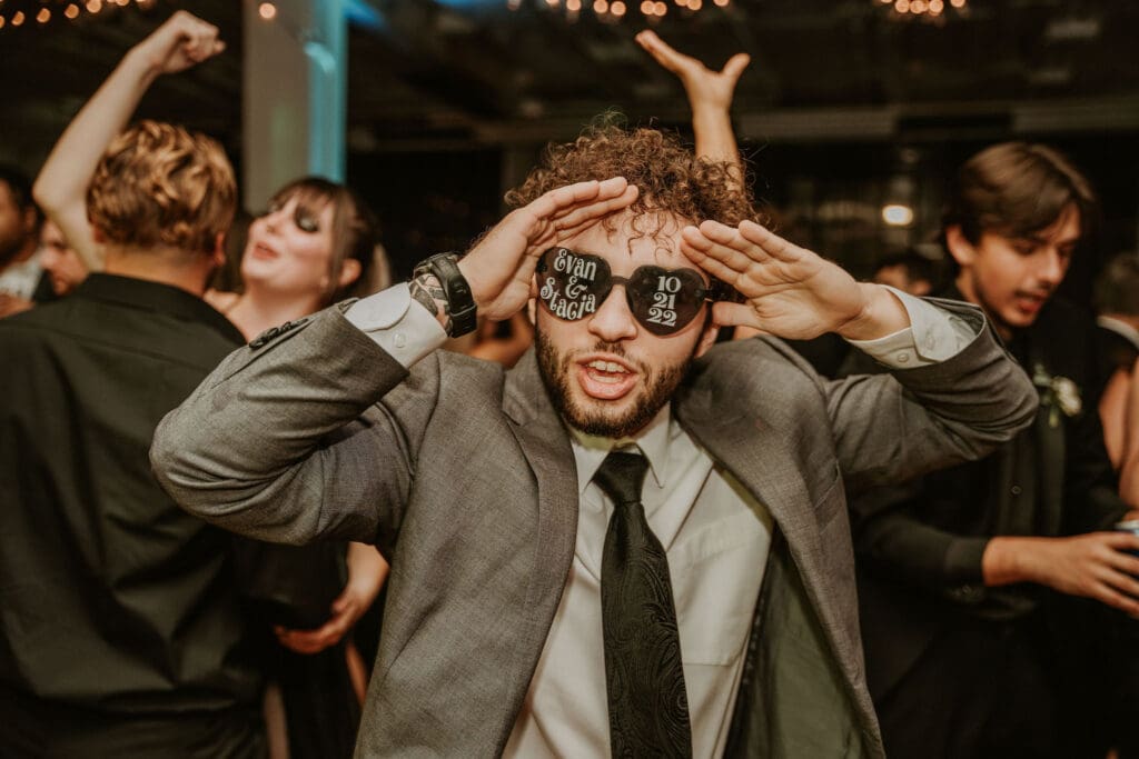 The dance party continues complete with custom wedding heart sunglasses