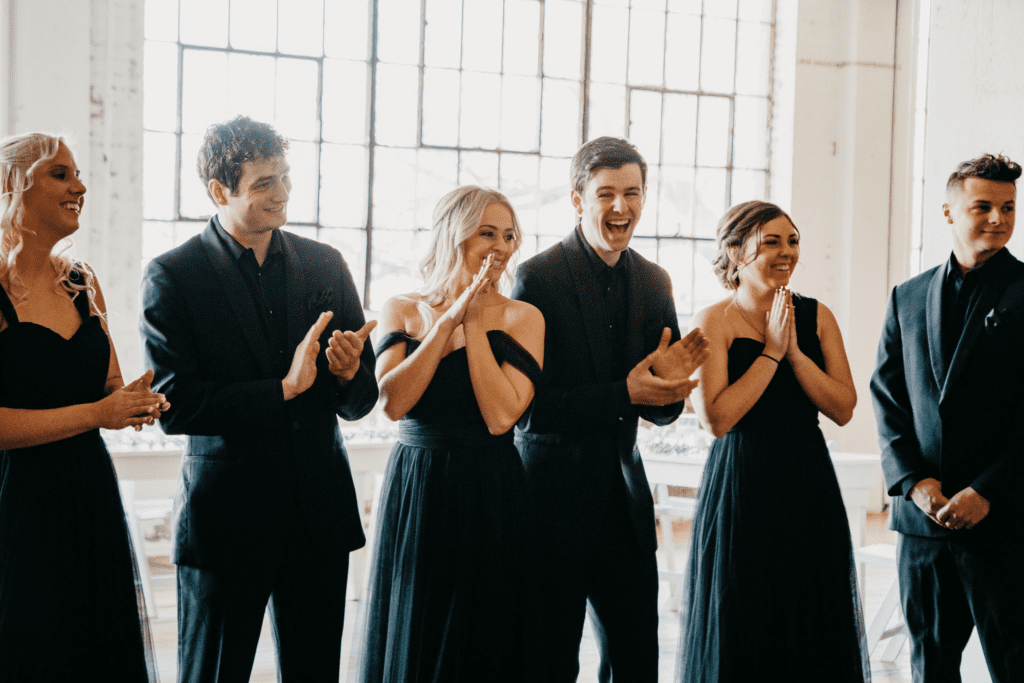 Sweet first look moment with entire wedding party