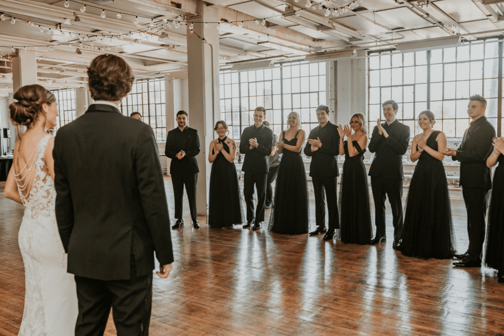 Wedding party seeing the bride and groom together for the first time