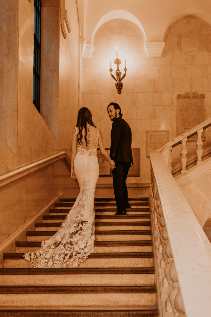Elegant golden light post wedding portraits at Cleveland Public Library