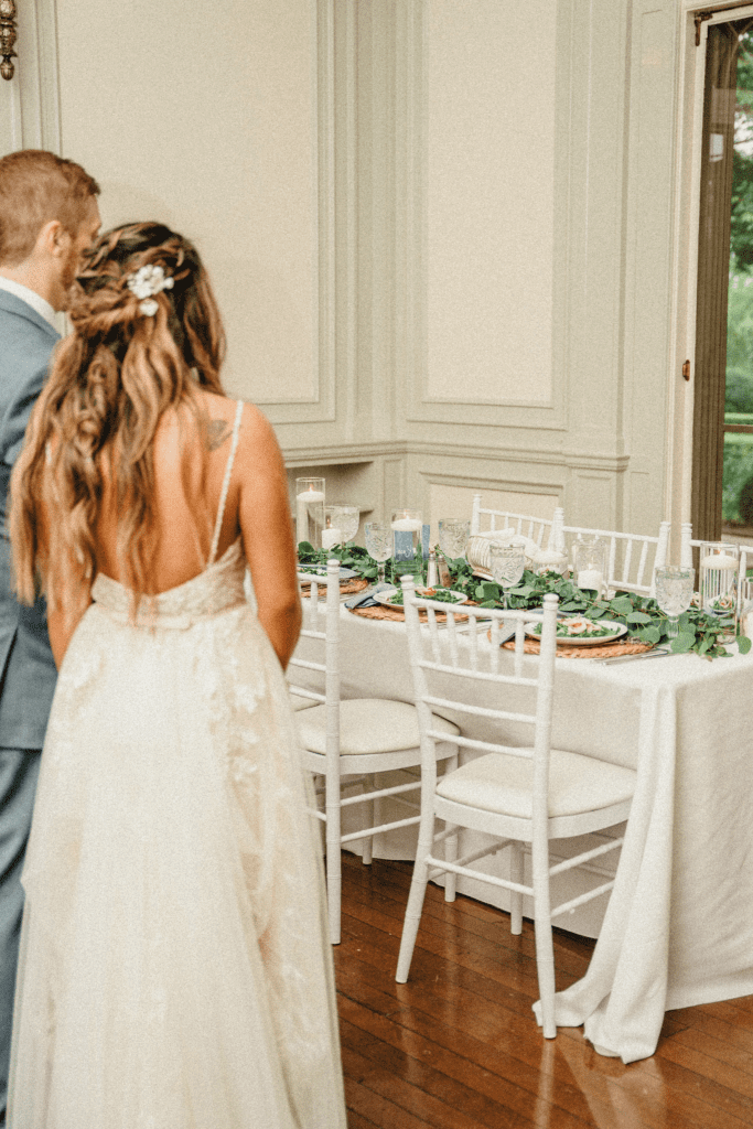 Couple admiring the coastal chic place settings